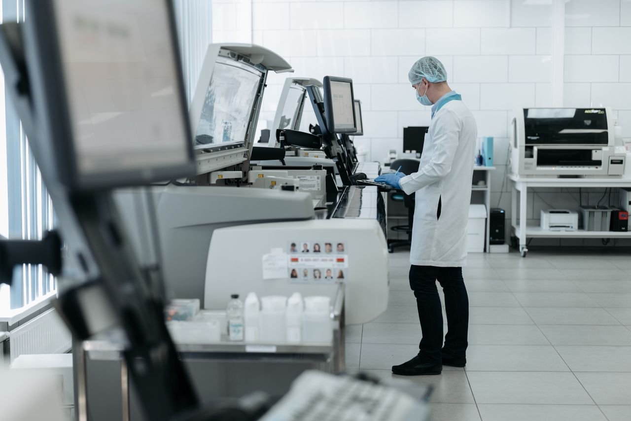 services-01 A scientist in a lab coat using advanced laboratory equipment in a clean, modern lab.